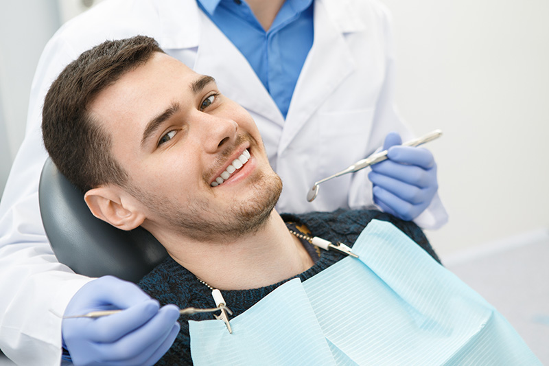young man getting a dental exam