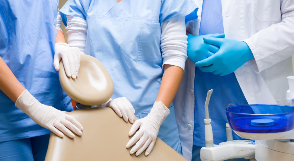 dental team near dental chair