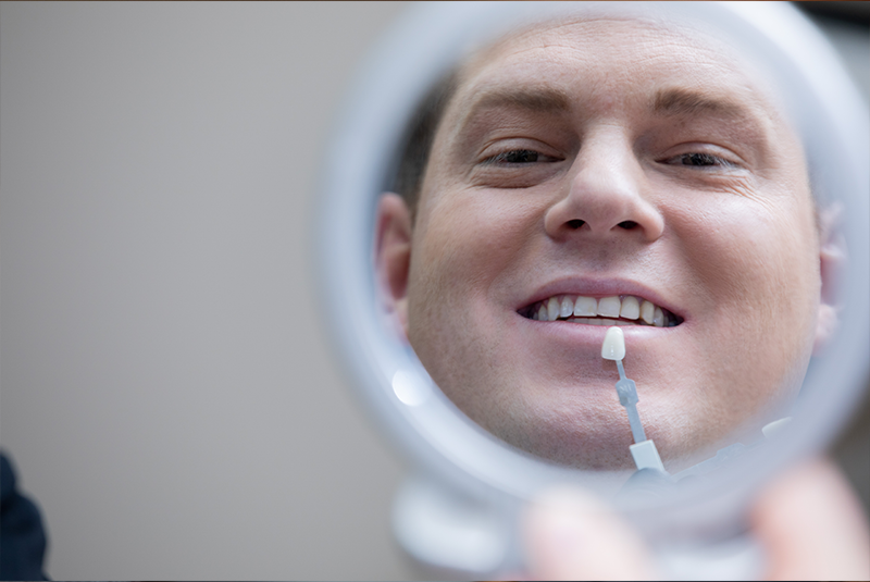 Looking in the mirror at the dentist