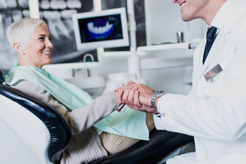 Dental Implant Patients Smiling After Their Procedure