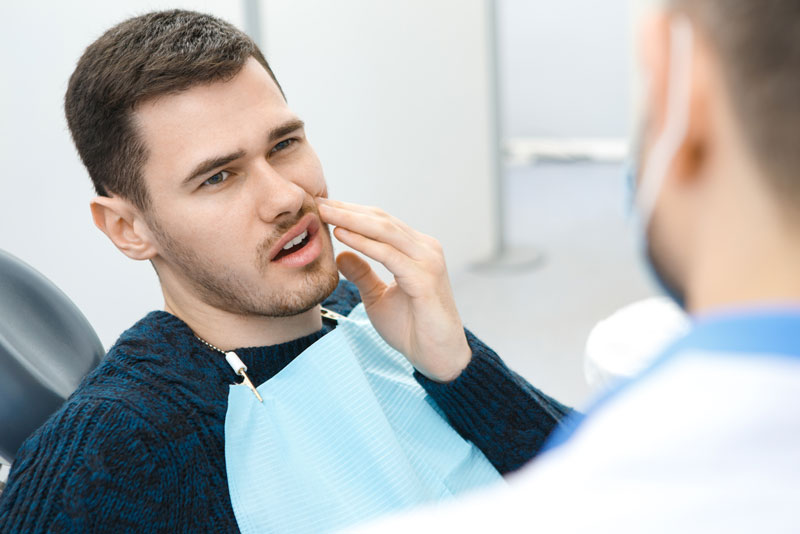 Dental Patient Suffering From Mouth Pain On A Dental Chair, In Oakdale, PA