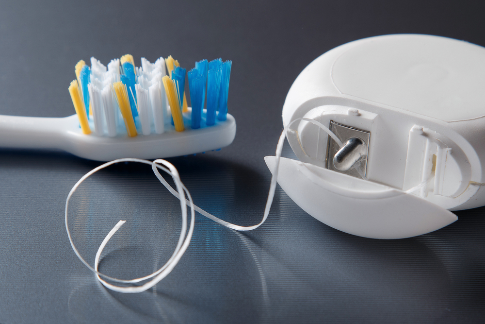 close up of toothbrush and floss