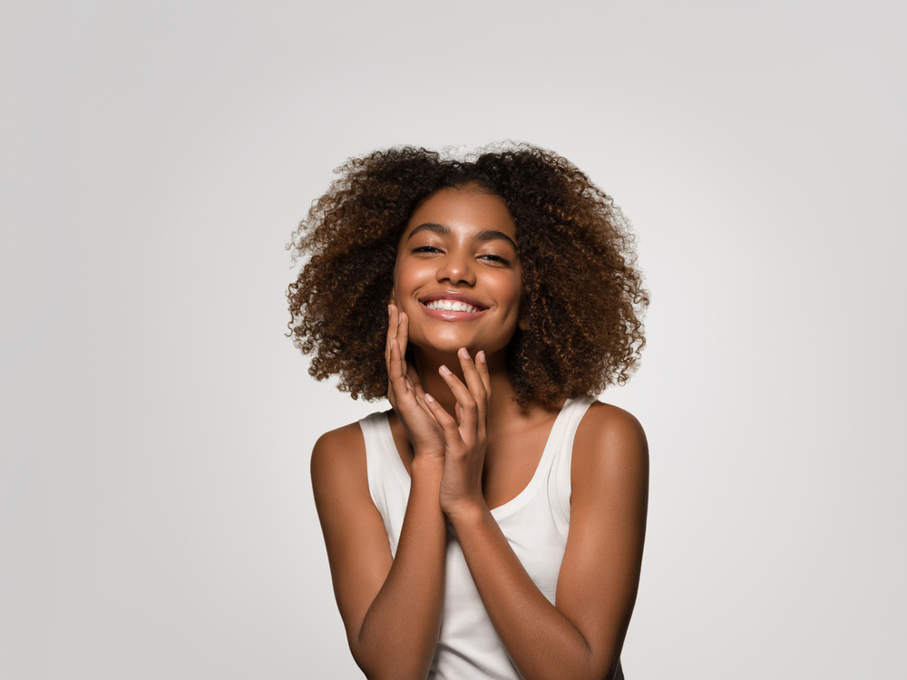 young beautiful woman smiles big