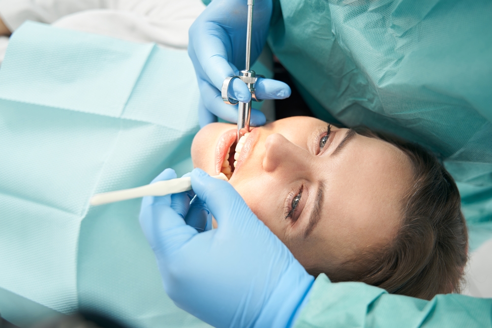 woman receives dental exam