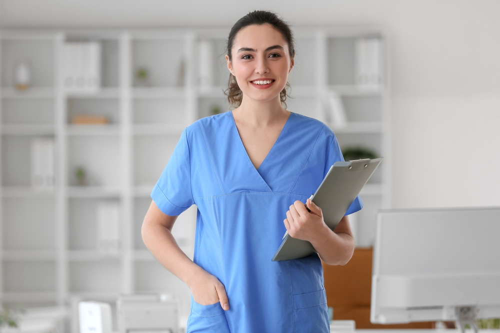 young medical professional in blue scrubs